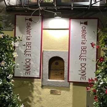 place with a tiny window and surrounded by flowers