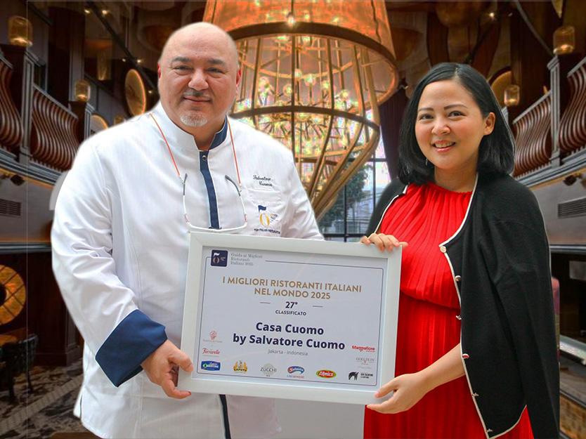 two persons holding certificate with restaurant background
