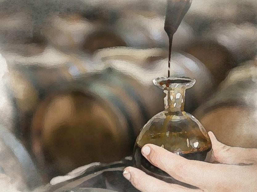 a person pouring balsamic vinegar