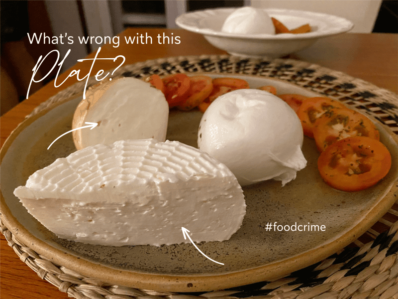 a plate with different cheeses