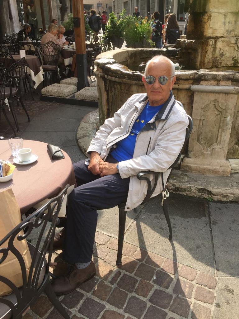 an old man sitting on the chair